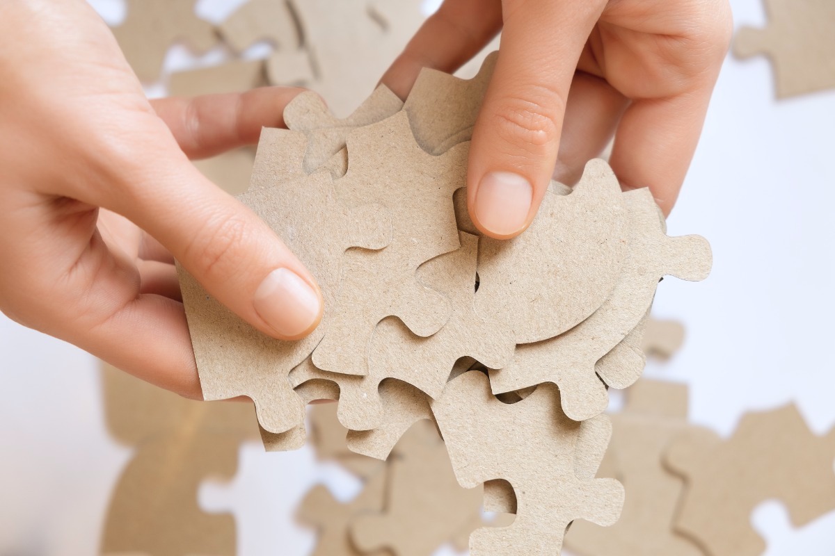 cardboard-puzzles-female-hands-close-up